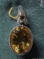 Front view of oval citrine silver pendant