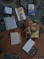 All items spread out showing decorative box, sealed packs, loose cards and pads