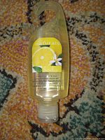 Front view of Avon Naturals Lemon & Basil shower gel bottle