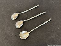 Three twisted-handle Russian silver spoons