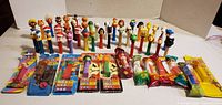Overview showing entire lot of loose and sealed PEZ dispensers