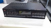 Front of Fisher amplifier showing equalizer sliders, controls and 100 W sticker