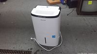 Front view of Honeywell dehumidifier showing full unit and power cord