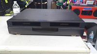 Front view of Mirage GoVideo dual deck VHS recorder closed