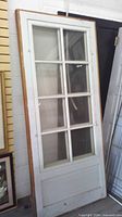 Full view of first window panel leaning against wall