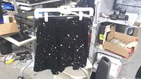 Front view of black sequin skirt on hanger