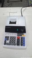 Top view of Sharp EL-1197P III printer calculator showing keys, display and paper holder