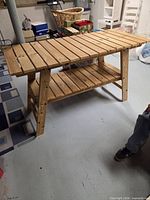 angled view showing full table with top and lower shelf