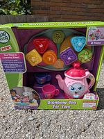 Front view of boxed LeapFrog Rainbow Tea for Two set showing contents and branding
