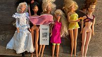 Group shot of six dolls laid side by side