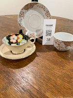 Both teacups and saucers displayed on table