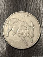 Reverse of 1 Piso coin with tamaraw image and denomination