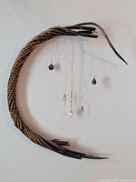Full view of crescent twig wall wreath hung on wall