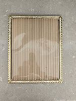 Front view of gold-tone picture frame