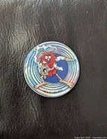 Front view of pog showing Pogman James Bond design