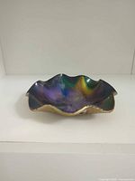 angled front view displaying bowl shape and iridescent finish