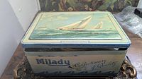 Milady Confectionery tin closed showing sailboat lid artwork