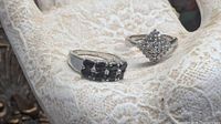 Front view of both sterling silver rings displaying stone clusters