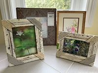 Group shot showing all four framed artworks