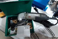Rockwell Sonicrafter tool with power cord in green box alongside accessories and literature