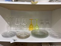 All glassware and plate stacks on shelf