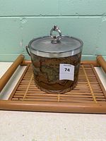 Ice bucket on rattan tray showing exterior map design