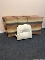 Front view of two striped high-back cushions and one white seat cushion