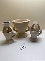 Full view of three soapstone burners and frankincense