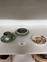 Cup, saucer, ashtray, trinket dish grouped