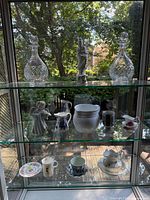 Full view of three glass shelves with all items displayed