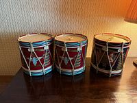 All three British regiment drum ice buckets side by side on table
