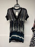 Front view of Bedo dress hanging
