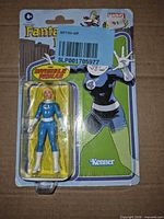 Front of sealed card showing figure and sticker