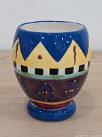 Overall view of hand-painted ceramic tumbler front