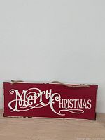 Front side of sign showing "Merry Christmas" text