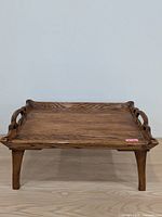 Full view of wooden bed tray on floor