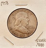 Obverse view of 1958 Franklin half dollar in cardboard flip