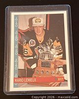 Front of card in sleeve showing Mario Lemieux with Conn Smythe Trophy