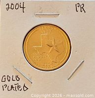 Coin in 2x2 flip showing reverse with Texas design