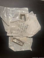 Multiple Lee Valley bags containing brass label holders