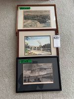 Group shot of three framed artworks stacked