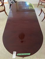 Top view of full table with leaf inserted showing oval shape and finish