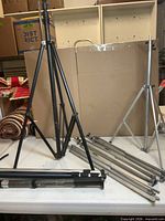 Group of lighting stands and monopods on table