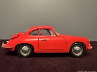 Left side profile of red Porsche 356 B model