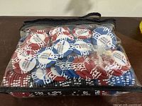 Bag containing mixed red, blue, black World Poker Tour poker chips