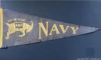 Front of pennant showing goat mascot, slogan and NAVY text