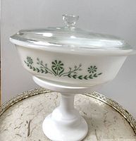 casserole with lid shown assembled, side floral pattern visible
