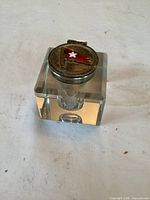 Overall view of glass cube inkwell with White Star Line emblem lid closed