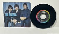 Record with picture sleeve front showing Beatles photo and title