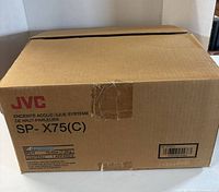 Factory carton labeled JVC SP-X75(C) on table